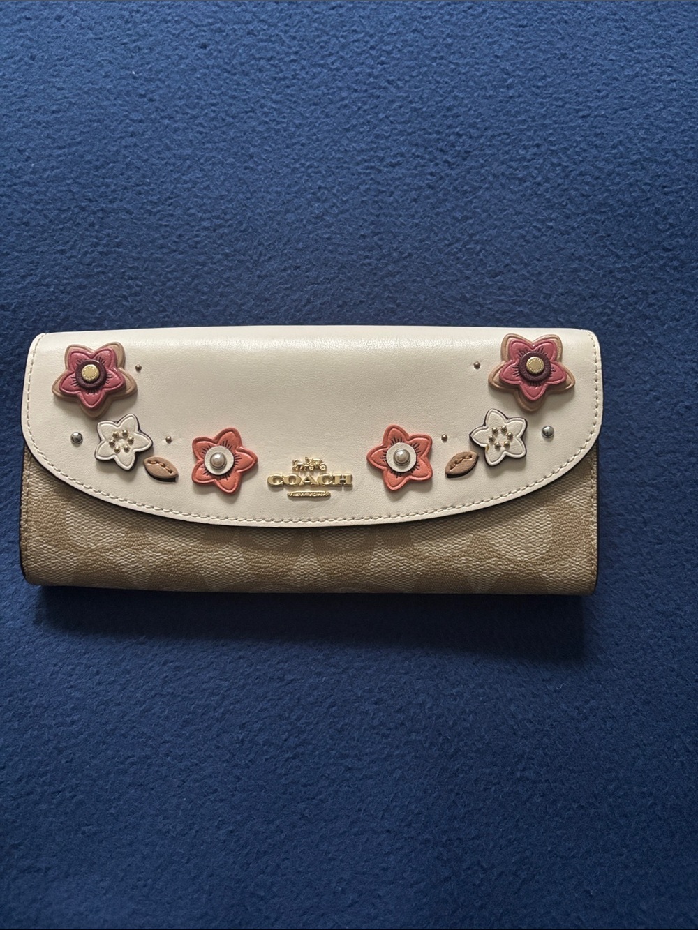Coach wallet with appliqués